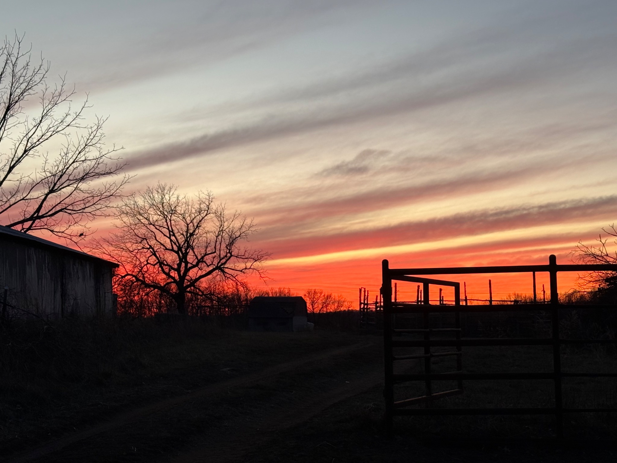 Actual Windchaser sunset over the ranch gate
